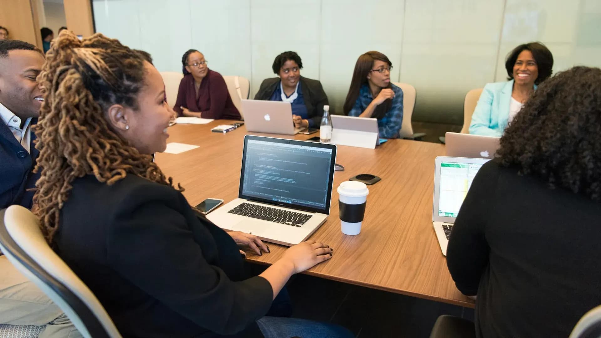 Professionals learning new AI skills together in a collaborative workshop