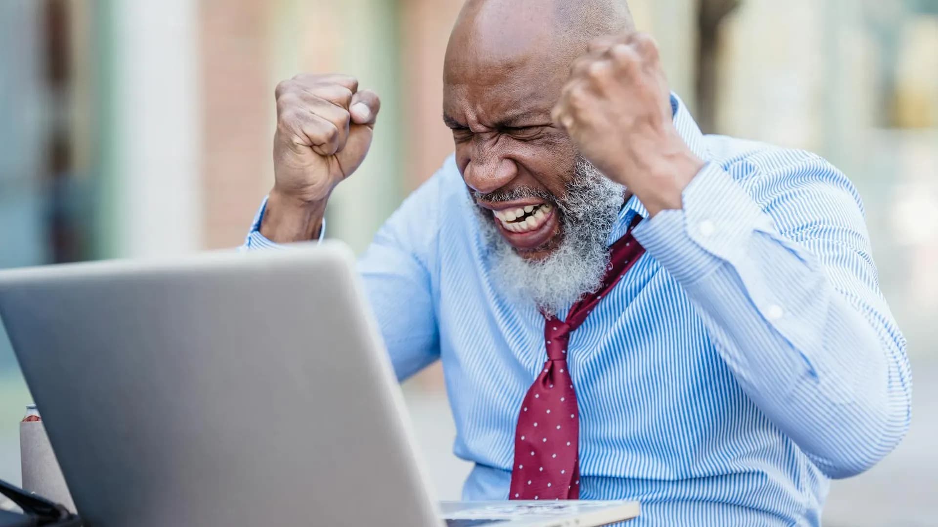 Frustrated professional realising AI mistakes at his desk