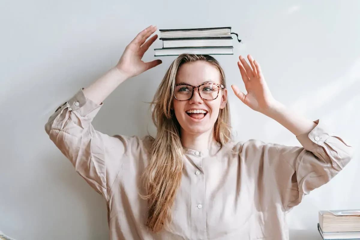 Happy student studying with flashcards and laptop