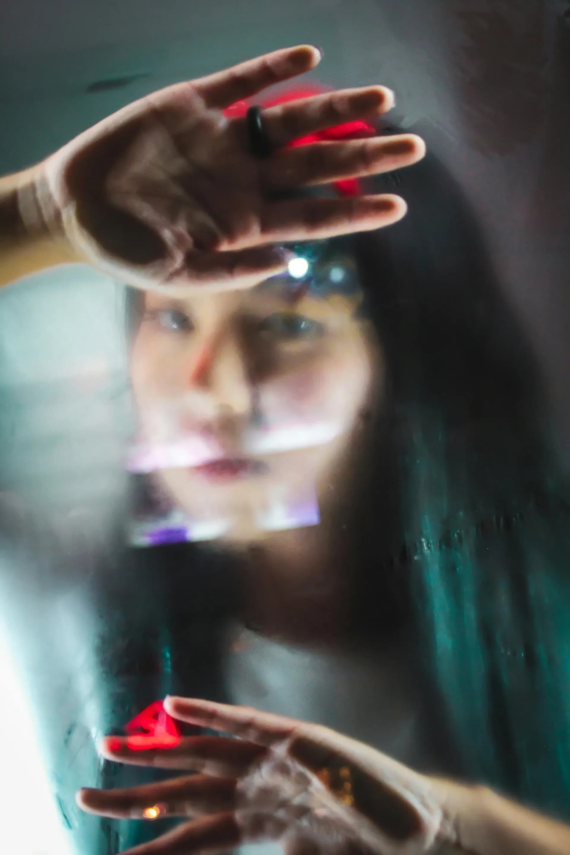 Professional woman looking thoughtfully through an office window, reflecting on career and AI