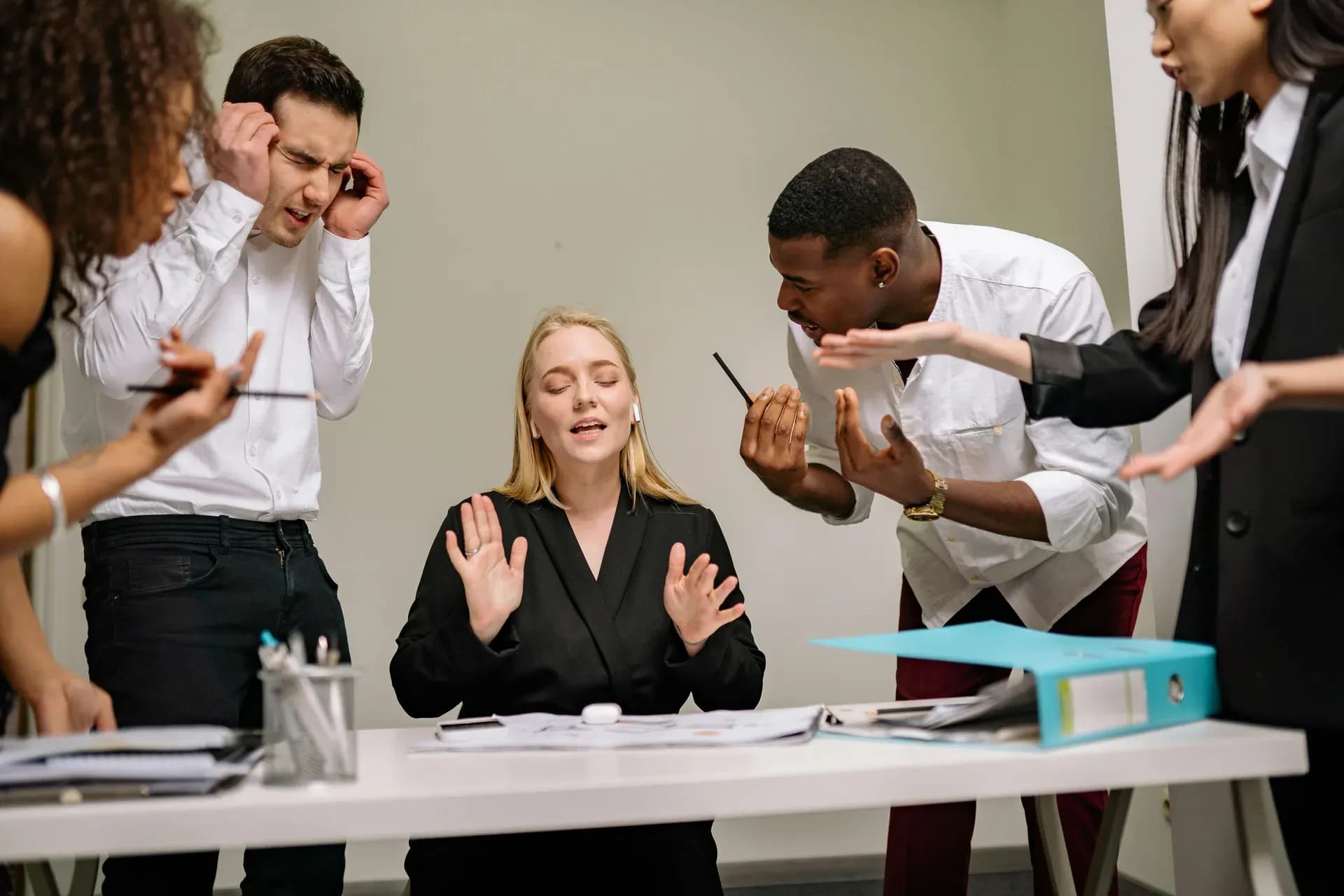 Colleagues in a meaningful workplace conversation, reading the room